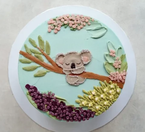 A hand-painted koala cake