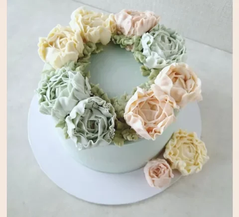 A pastel peonies buttercream cake