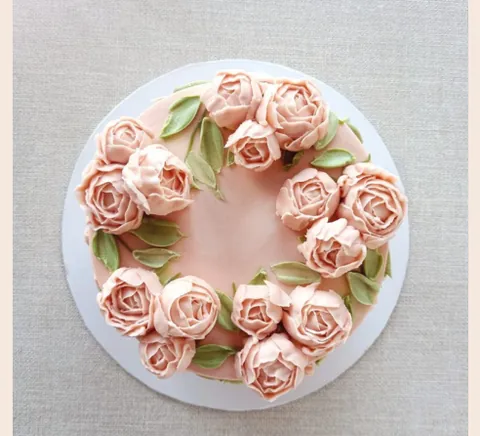 A buttercream rose wreath cake