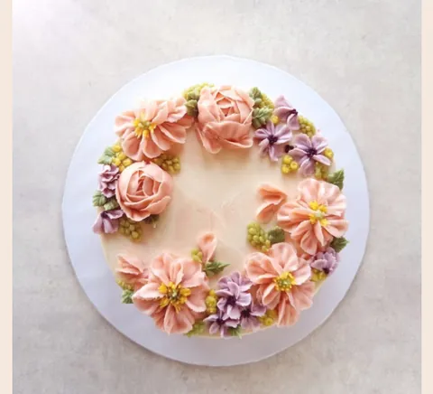 A champagne blush embroidered cake